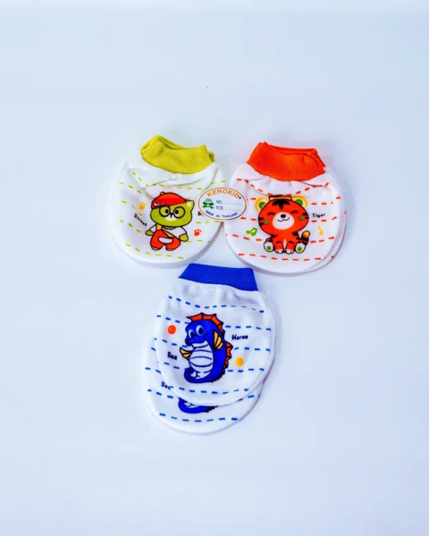 Assortment of three infant no scratch mittens in green, orange tiger, and blue seahorse prints.