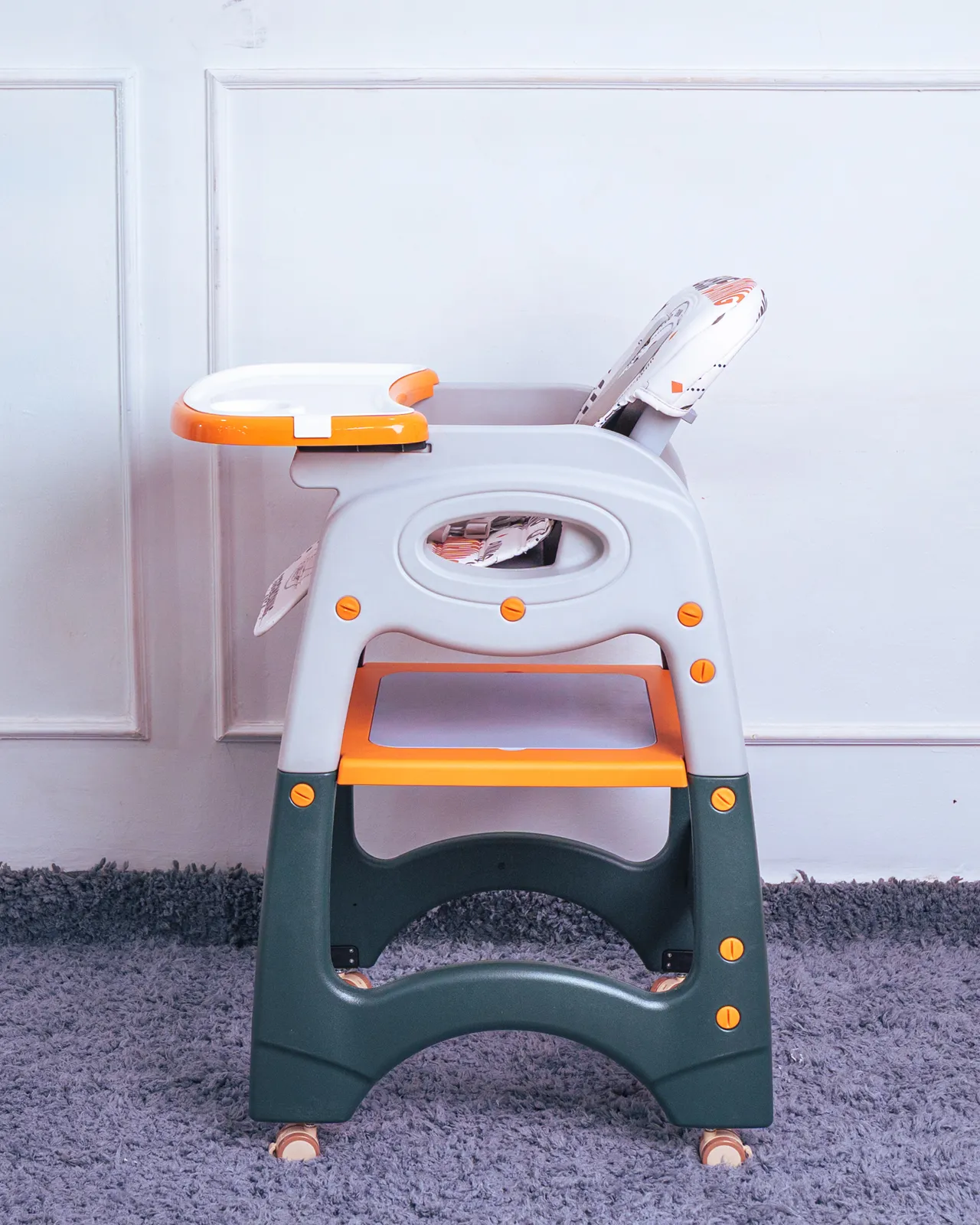 3 In 1 High Feeding Chair 11 Side Profile Of The Secure Baby Feeding Chair With The Tray Attached And The 5-Point Harness Visible.