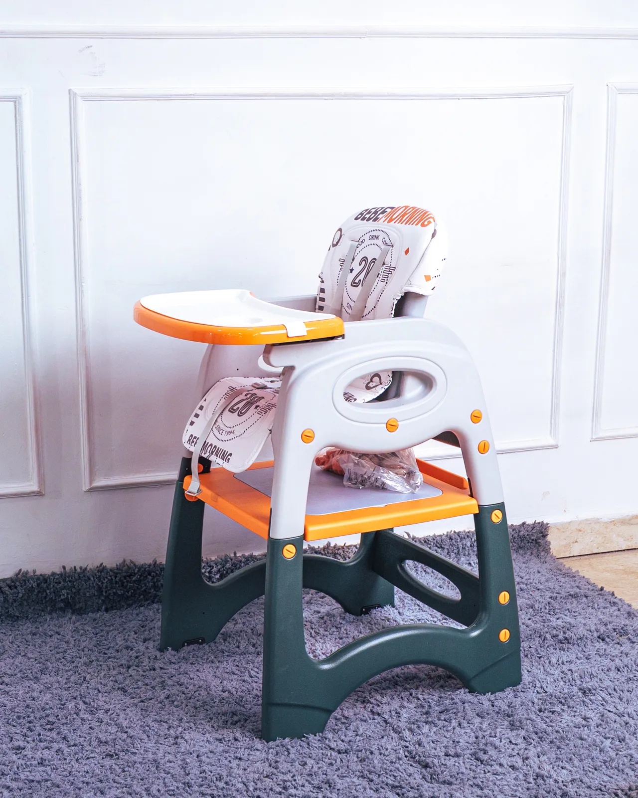 3 In 1 High Feeding Chair 4 Side Profile Of The Secure Baby Feeding Chair With The Tray Attached And The 5-Point Harness Visible.