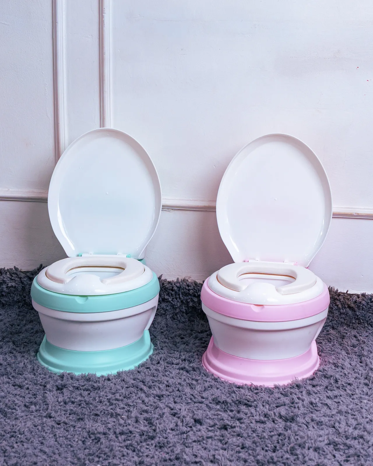 Toilet-Like Potty Trainer 12 Two Realistic Potty Chairs (Pink And Teal) Sold By Zawadi Baby Shop Nairobi. Durable And Safe.