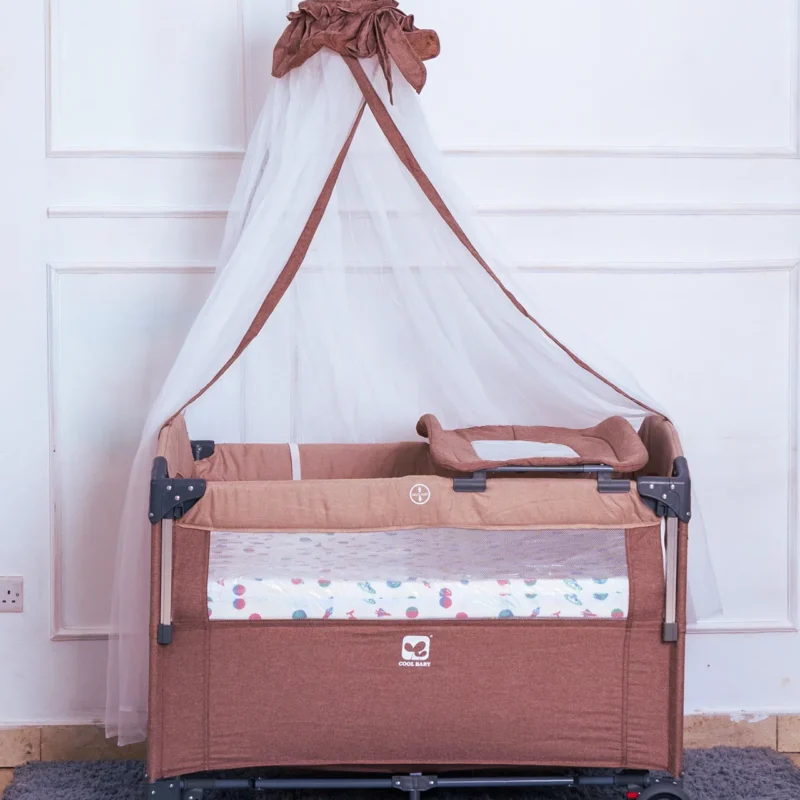 The Co-sleeper With Mosquito Net shown with the detachable changing pad attachment on the side.