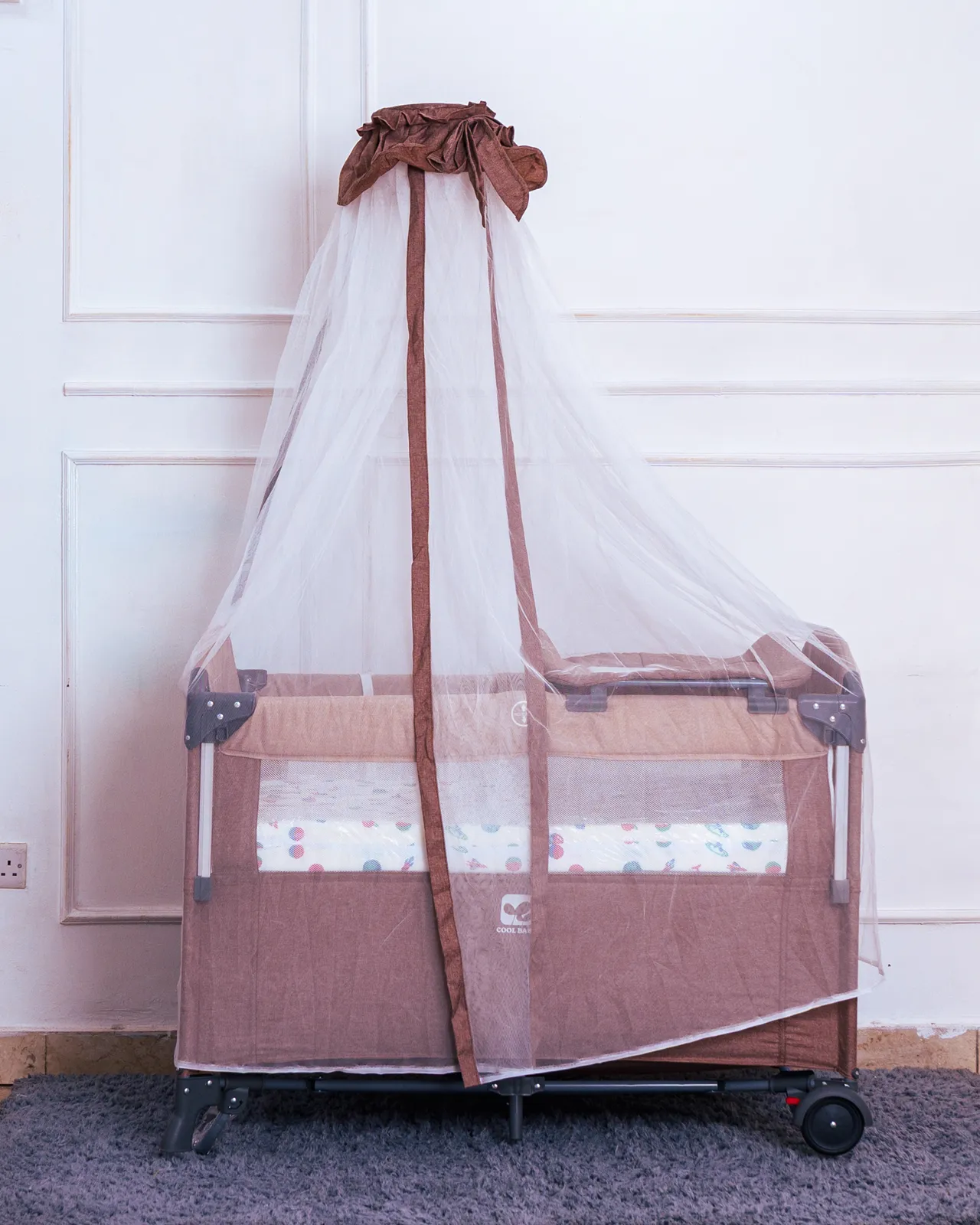 Co Sleeper With Mosquito Net 6 Safe Brown Sleeping Baby Cot Available At Zawadi Baby Shop Nairobi. Includes A Mosquito Canopy.
