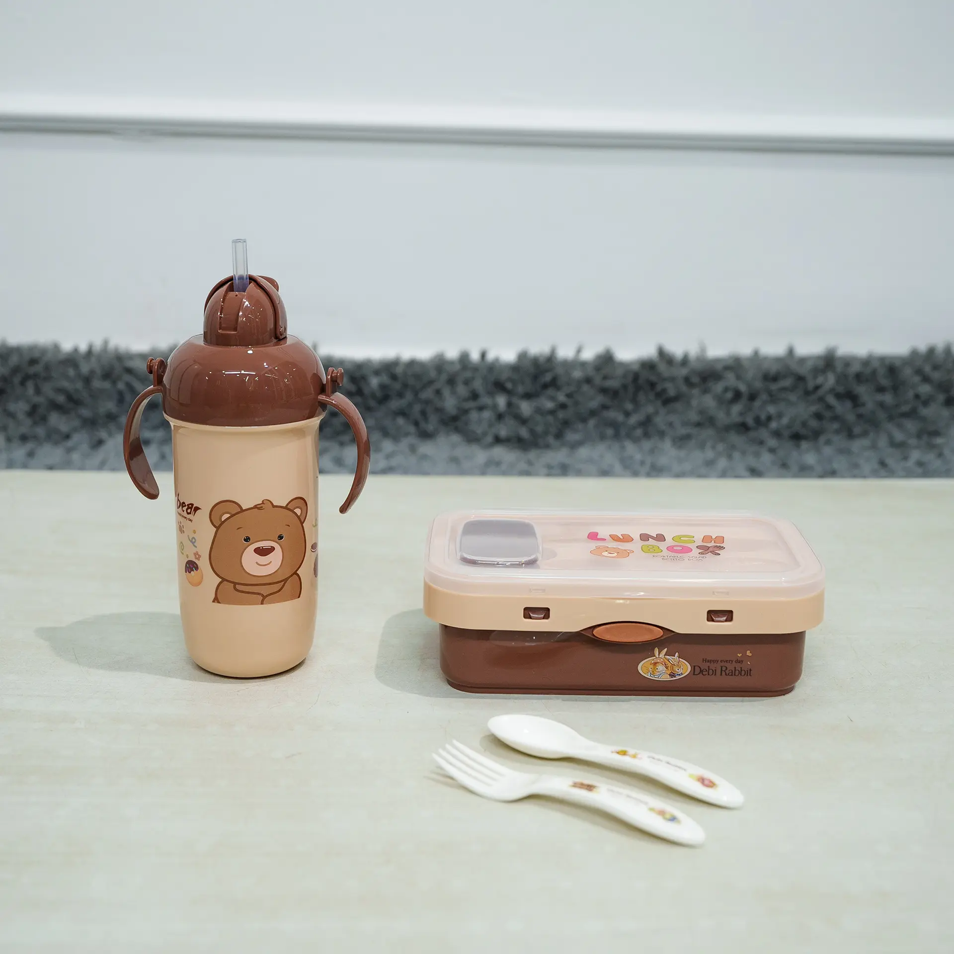 Lunch Box &Amp; Water Bottle Set 8 Brown And Beige Kids Lunch Set Featuring A Rectangular Lunch Box, A Handled Sippy Cup-Style Water Bottle With A Pink Bear Design (Resembling Lotso From Toy Story) And Pop-Up Straw, And A White Plastic Fork And Spoon With Pattern, Displayed On A Light Surface.