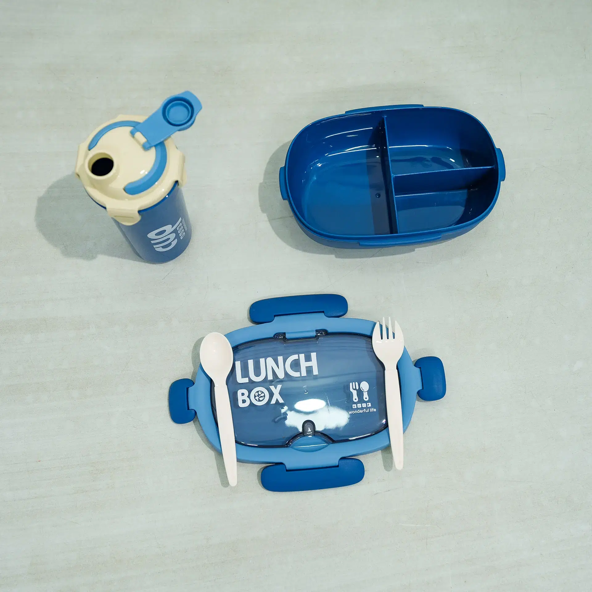 Lunch Box &Amp; Water Bottle Set 6 Blue And Beige Kids Lunch Set Featuring A Rectangular Lunch Box, A Handled Sippy Cup-Style Water Bottle With A Pink Bear Design (Resembling Lotso From Toy Story) And Pop-Up Straw, And A White Plastic Fork And Spoon With Pattern, Displayed On A Light Surface.
