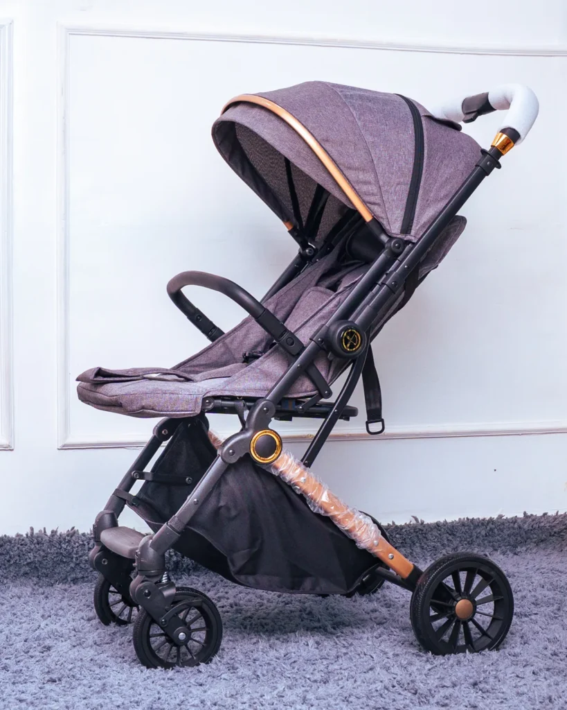 Close-up detail of the durable wheel and large under-seat storage basket of the travel stroller.