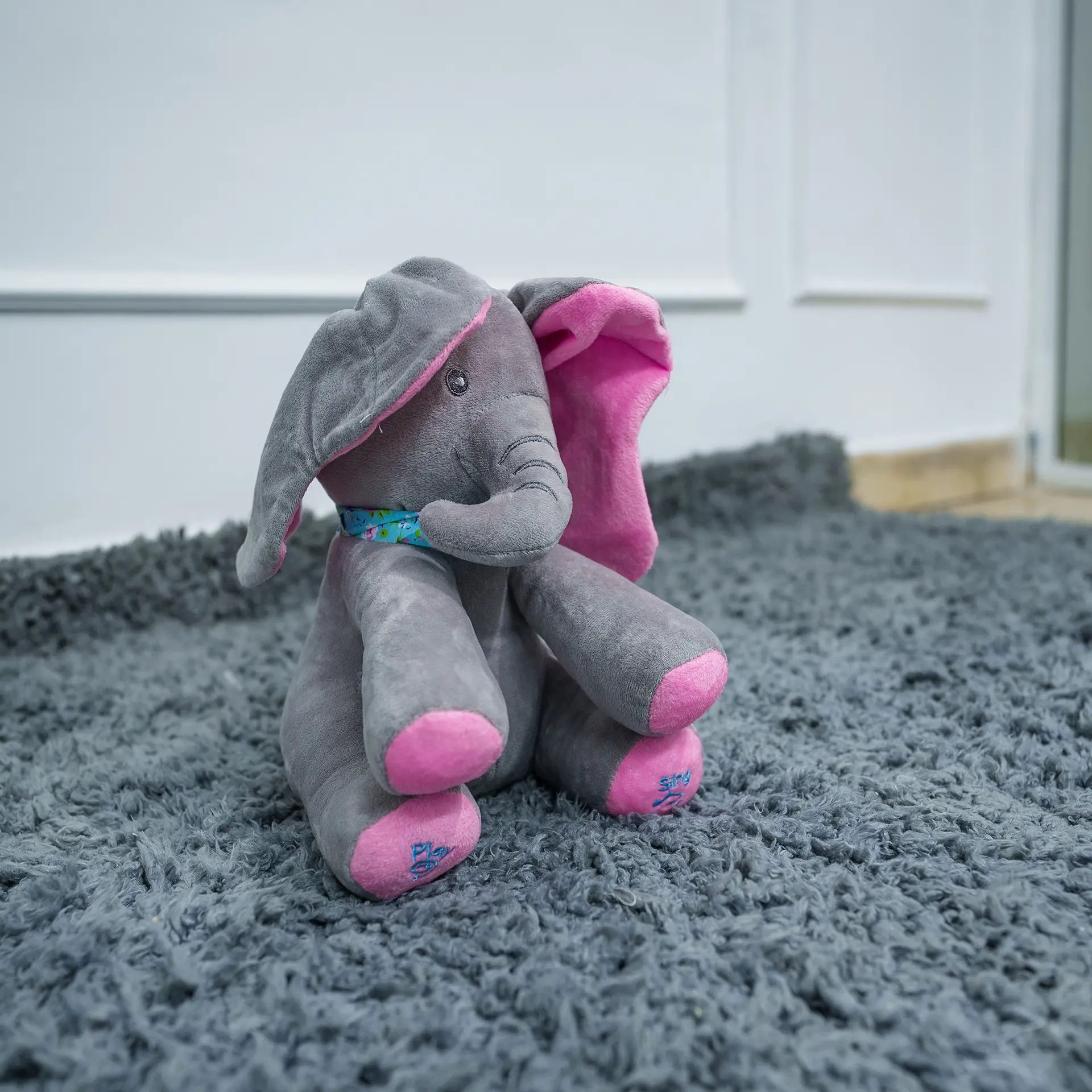 Elephant Soft Toy 3 Plush Gray Elephant Soft Toy With Pink Ears And Feet, Sitting On A Soft Gray Rug—Ideal For Babies And Toddlers, Available At Zawadi Baby Shop.