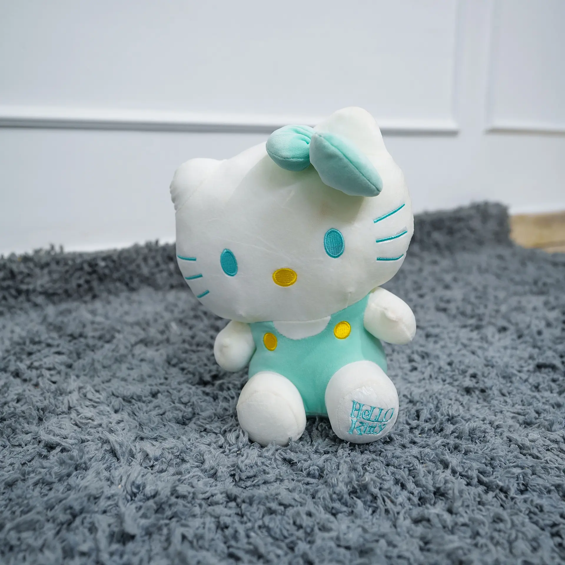 Plush Soft Toy 2 Pink Plush Soft Toy With A White Belly And Friendly Face, Displayed On A Grey Carpet In A Nursery Setting – Ideal For Babies And Toddlers.
