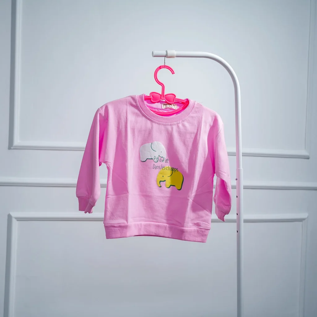 Pink baby sweatshirt with elephant design, made of soft cotton, displayed on a hanger against a white background.