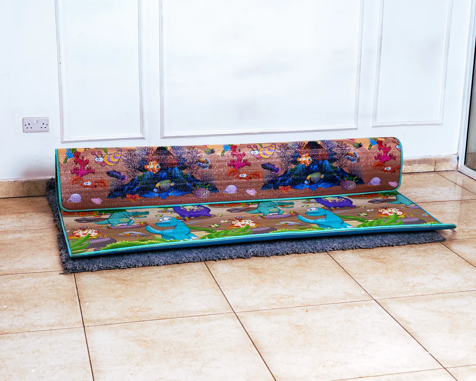 Play Mat Waterproof (1.9 By 2 Metres) 3 Close-Up View Of The Extra Thick Padding Of The Foldable Play Mat, Partially Rolled Up.