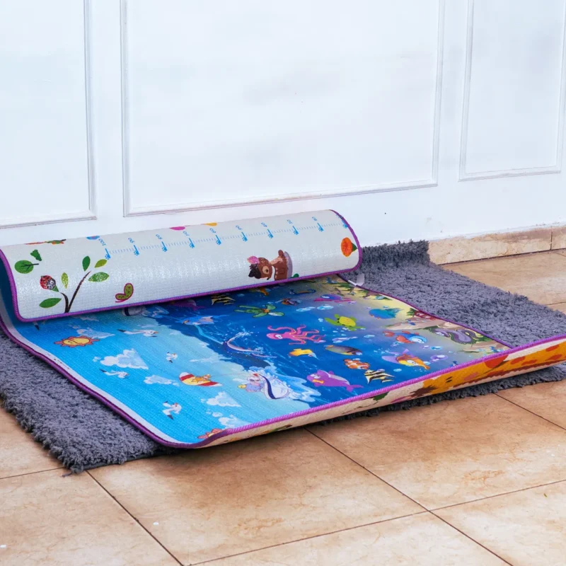 Side view detailing the extra-thick, cushioned foam layer of the 4x6 ft baby play mat.