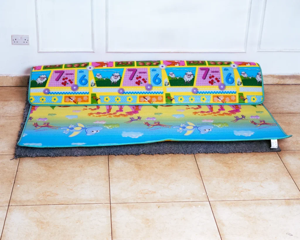 Floor mat for playpen featuring the reversible crocodile and underwater scene side.