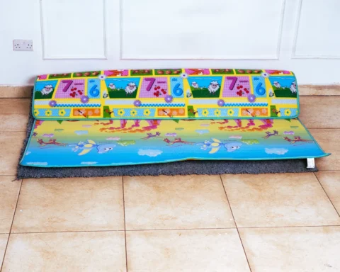 Floor mat for playpen featuring the reversible crocodile and underwater scene side.