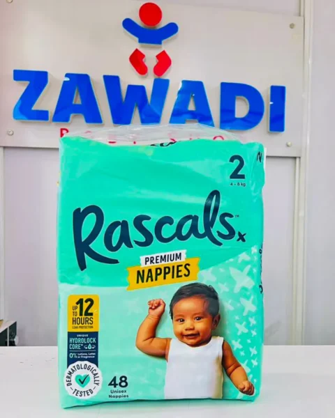 Retailer at Zawadi Baby Shop IBEA Building Nairobi holding premium Rascals diapers for countrywide delivery in Kenya.