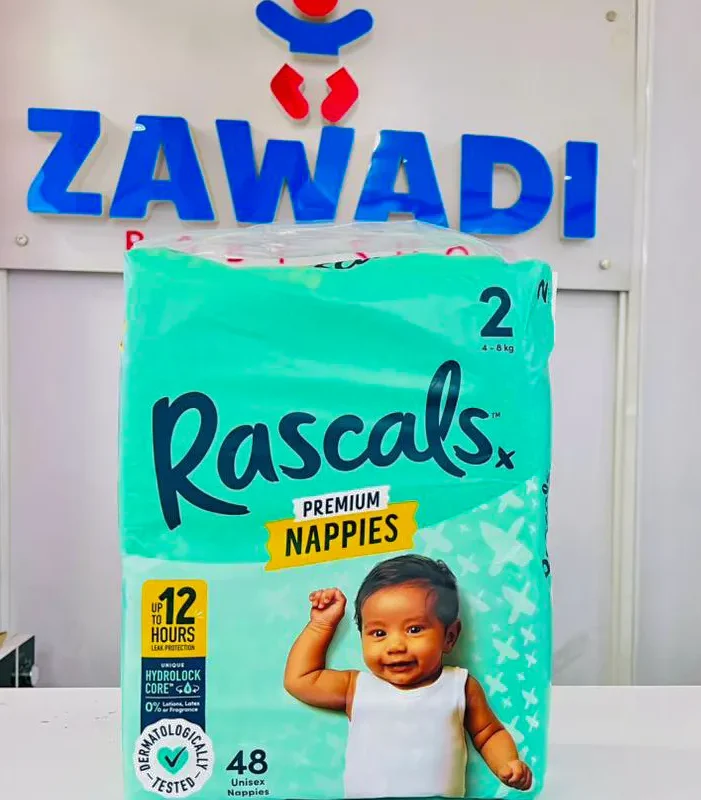 Retailer at Zawadi Baby Shop IBEA Building Nairobi holding premium Rascals diapers for countrywide delivery in Kenya.