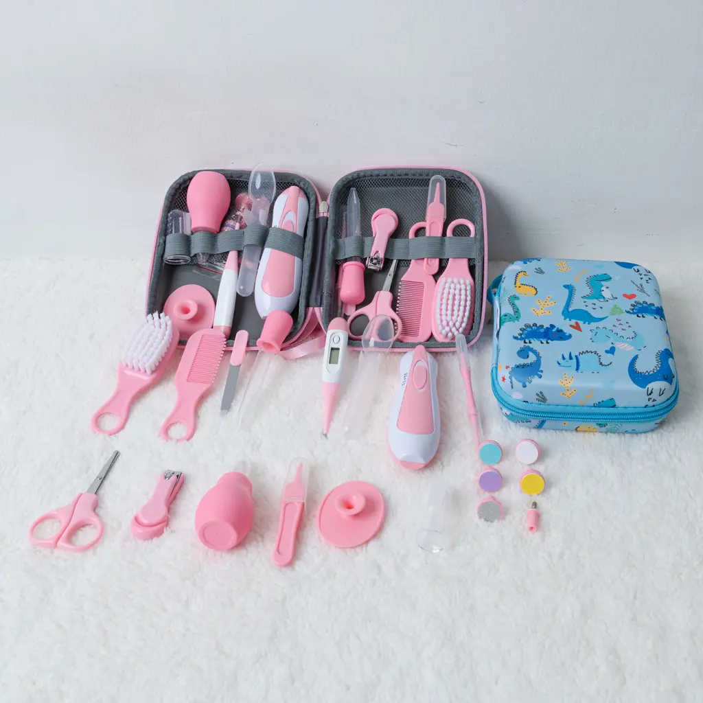 Pink 15 pcs baby grooming kit with electric nail trimmer and dinosaur case at Zawadi Baby Shop Nairobi.