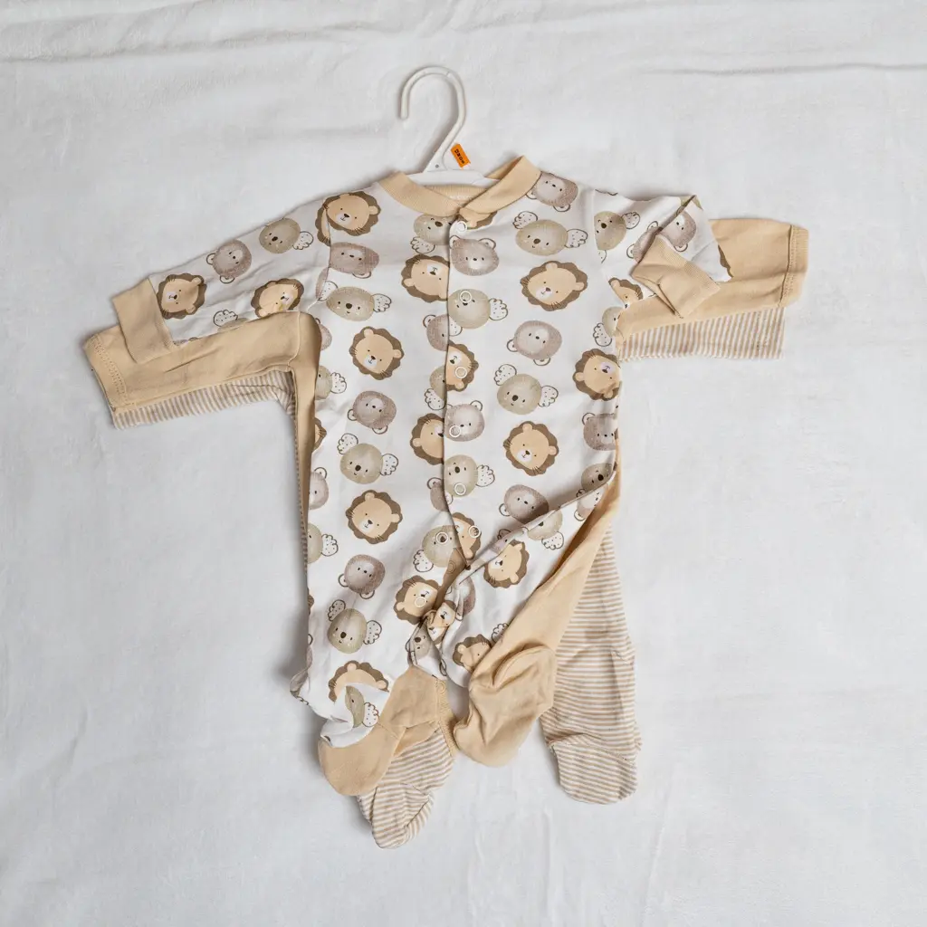 Cotton baby romper 3 piece set in cream with lion print at Zawadi Baby Shop Nairobi.
