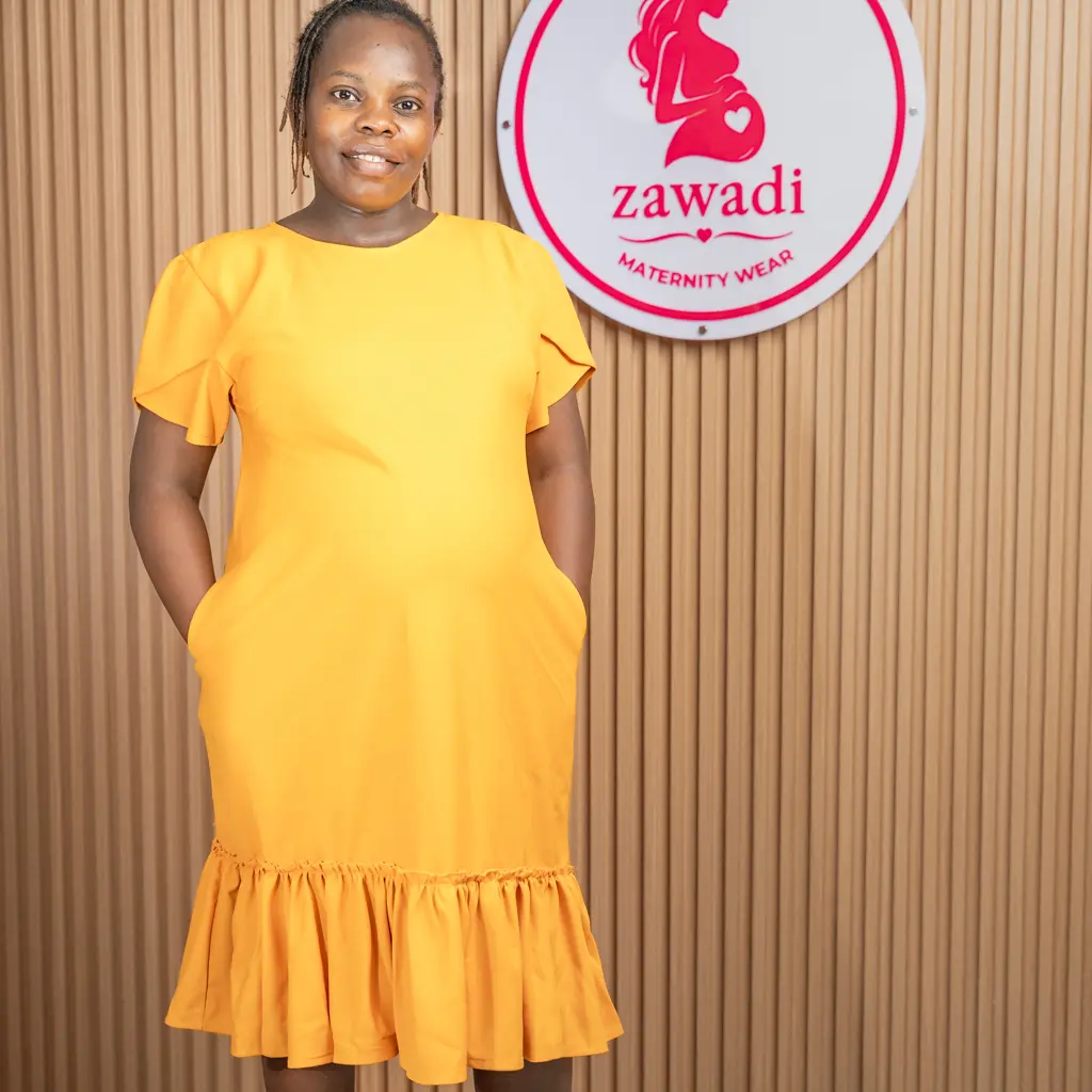 Official mustard yellow maternity dress with flutter sleeves at Zawadi Baby Shop Nairobi.